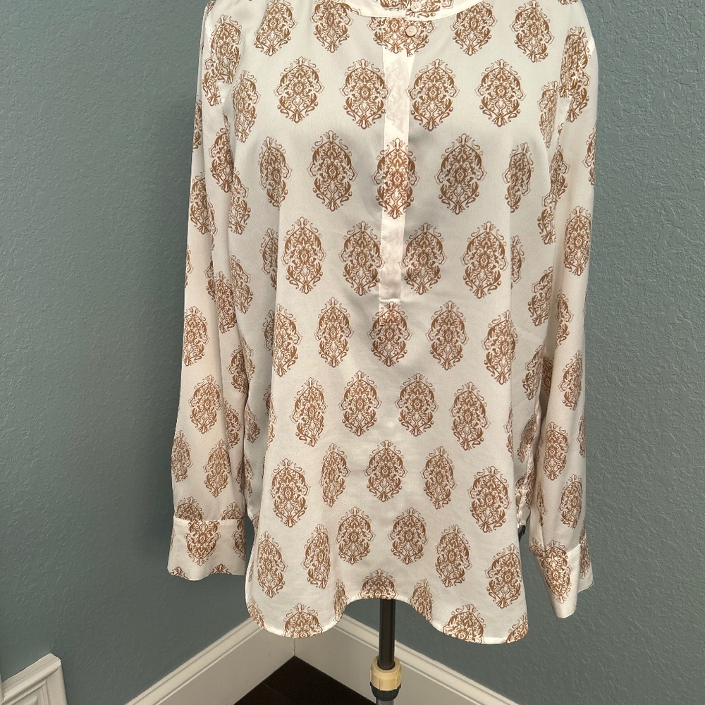 Cream and gold tunic top.